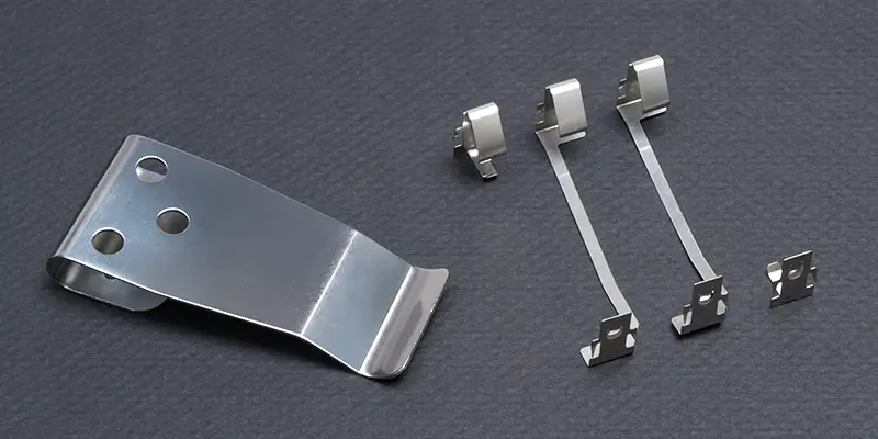 Complex flat springs – clip and battery contacts