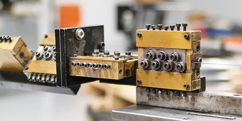Fourslide high-speed wire forming