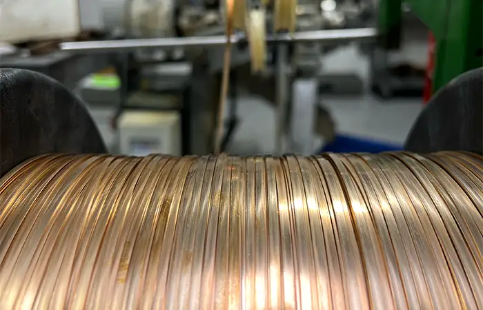 Metal parts created from strip material on a fourslide machine
