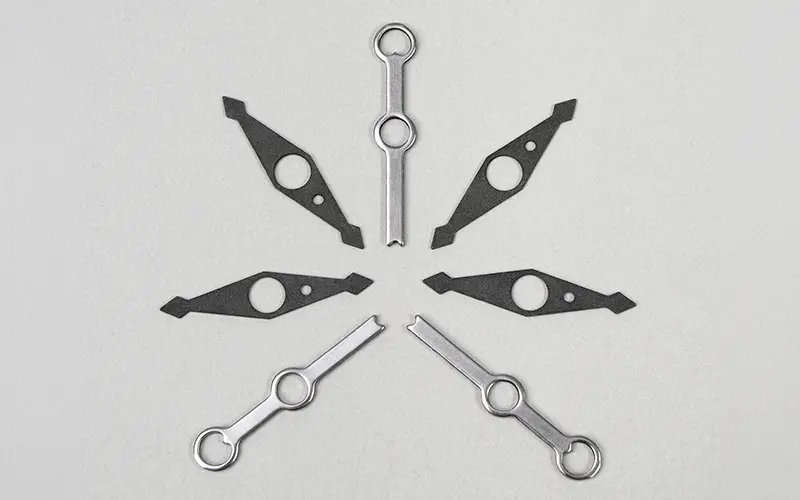 Fourslide stamped compass needles